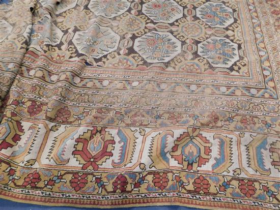 A large Indian carpet, circa 1910, 16ft 1in x 21ft 4in. (652cm x 491cm), fragment 5ft 11in. x 3ft 6in.